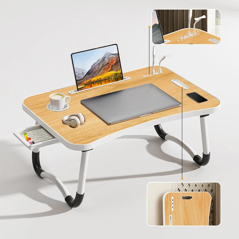 Multi-purpose foldable laptop desk with adjustable USB light and tablet stand for easy viewing.
