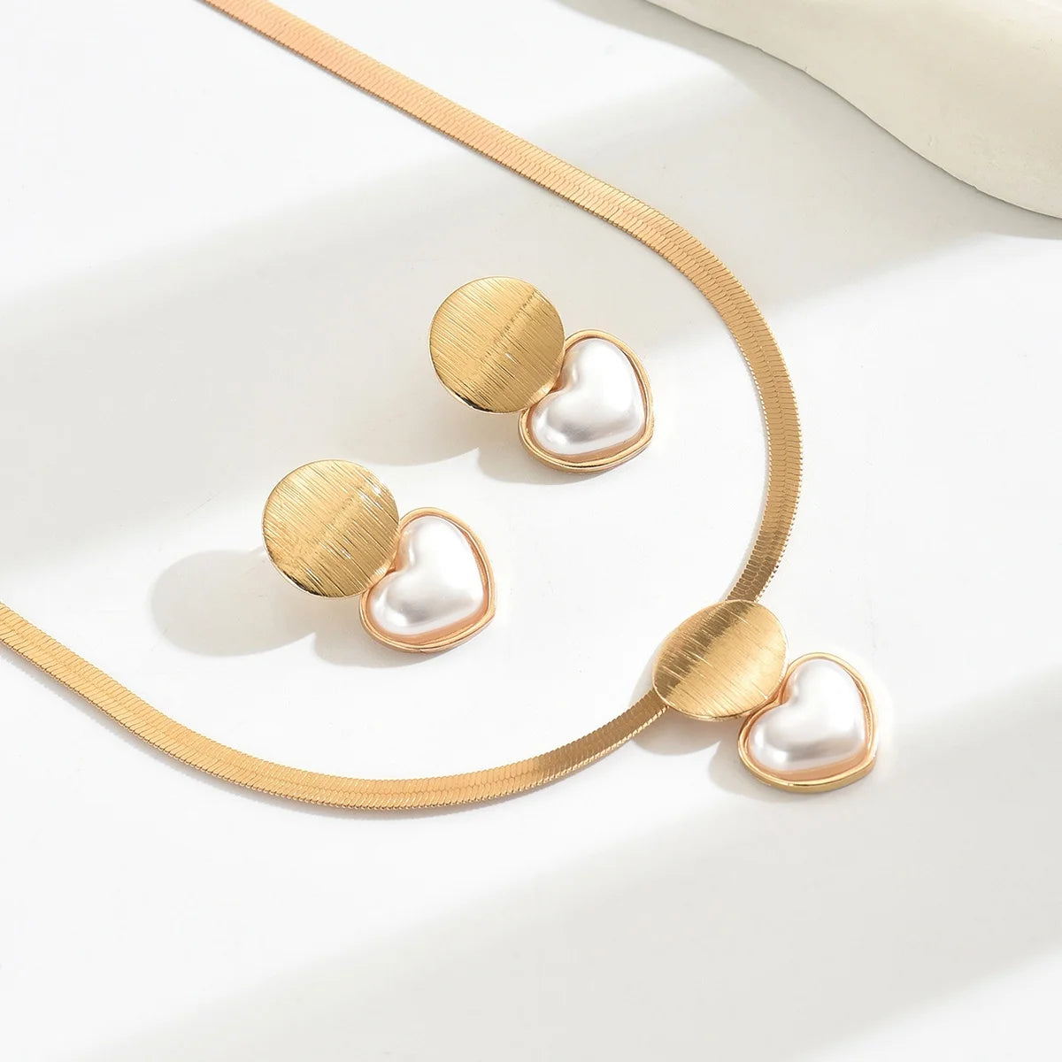 Classic gold-plated necklace and earrings jewelry set with elegant design.