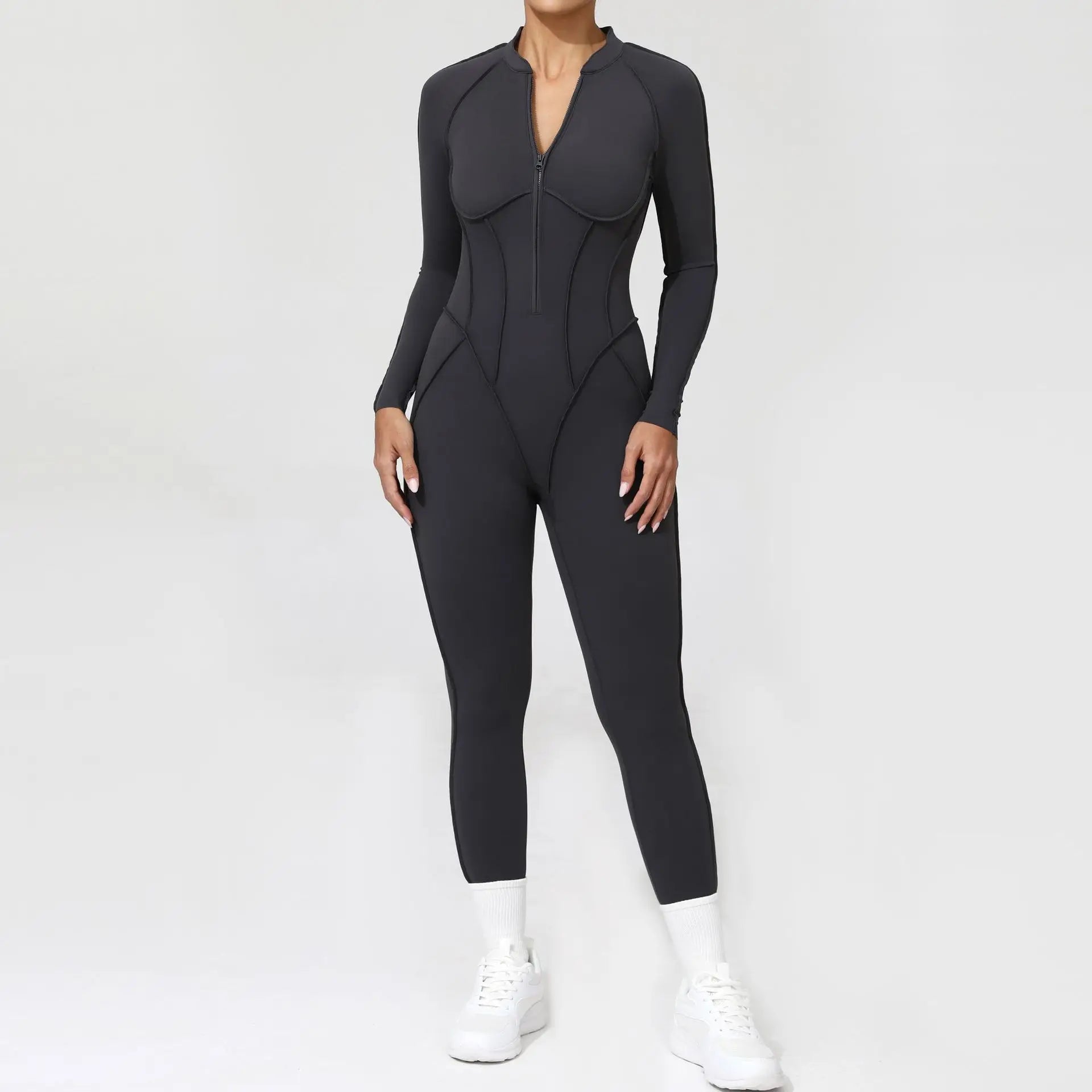 Black jumpsuit worn by a person on a white background