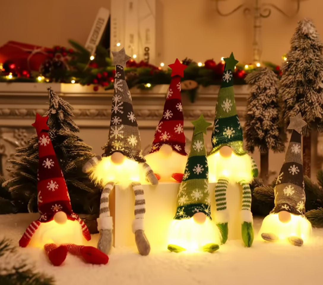 Decorative Christmas gnomes with lights in a festive setting.