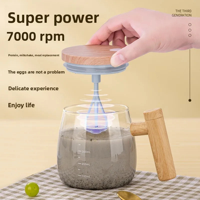 Hand holding a wooden lid above a glass container with a blender inside, on a checkered tablecloth.