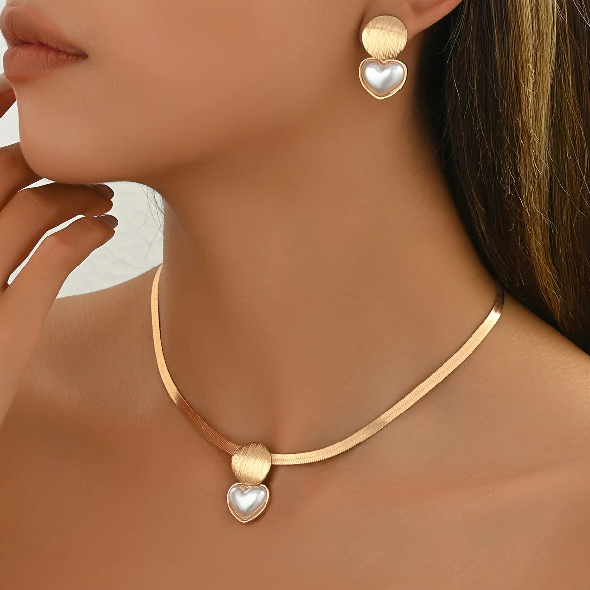 Elegant gold jewelry set with chic necklace and matching earrings for women.