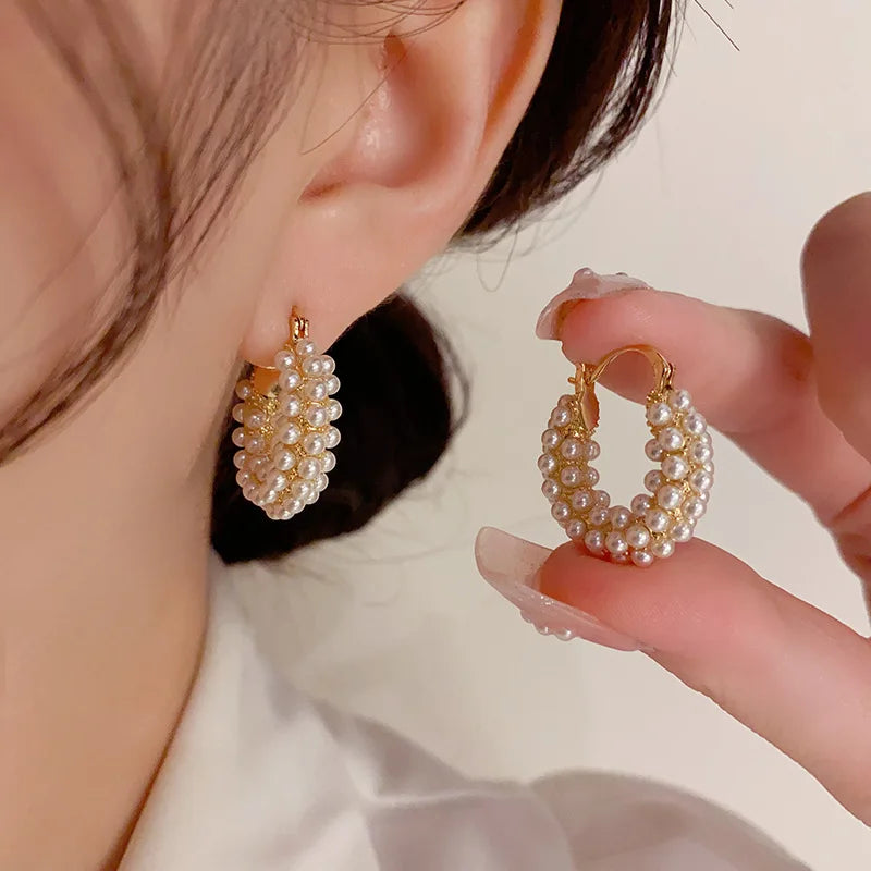 Elegant pearl hoop earrings with large round design, perfect for formal occasions.