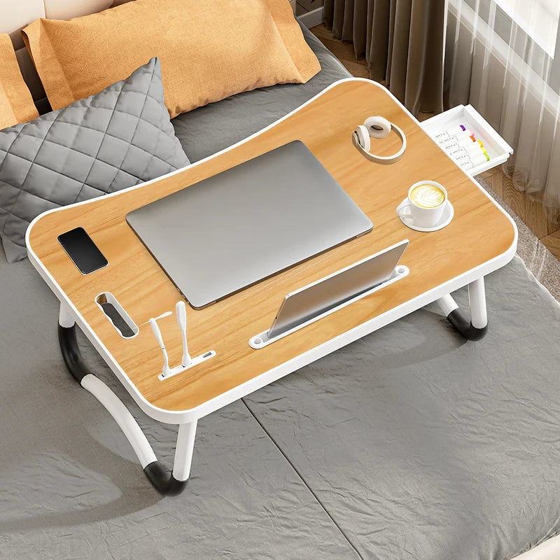 Ergonomic laptop desk with integrated USB LED light and slot for tablet or phone.