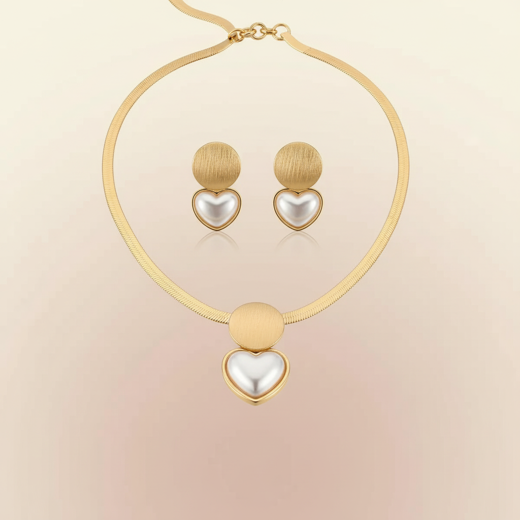 Gold necklace with heart-shaped pendants on a beige background