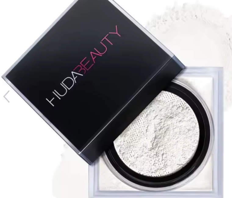 Huda Beauty powder with open case on a white background