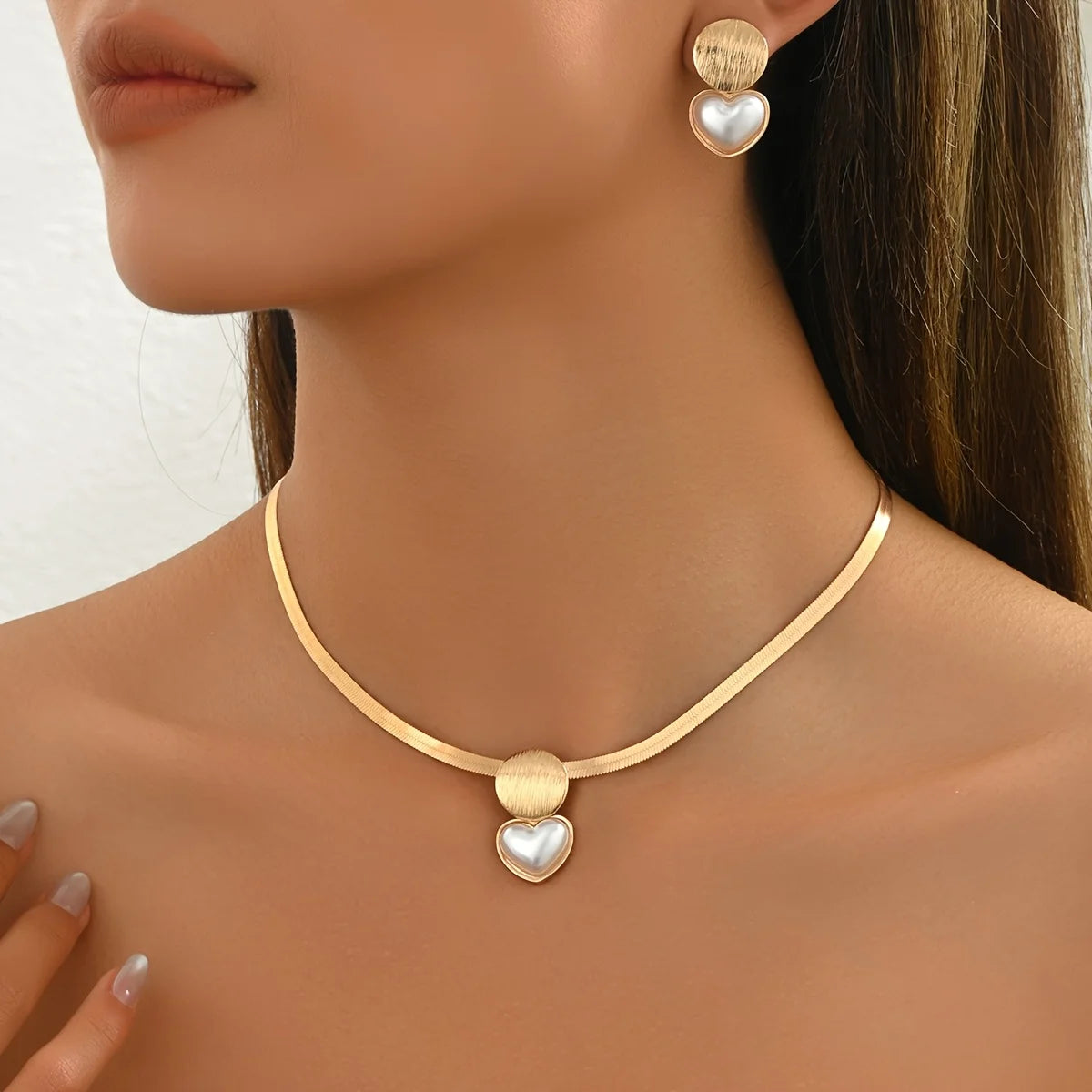 Luxury golden necklace and earring set, perfect for formal or special occasions.