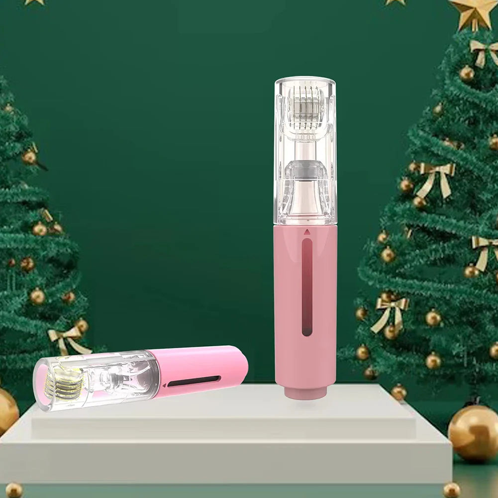 Pink electronic device with clear top section on a white platform against a green background with Christmas trees.