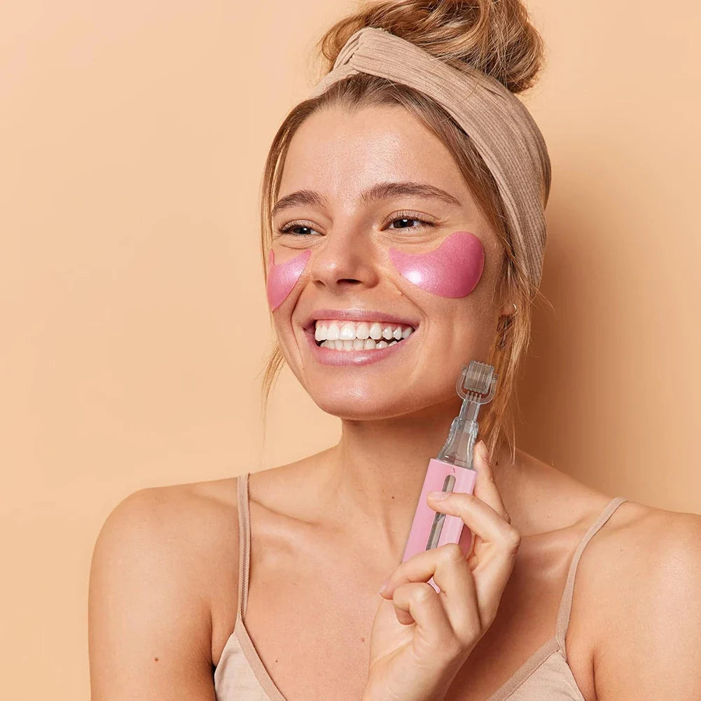 Woman with pink eye masks and a pink skincare tool on a beige background