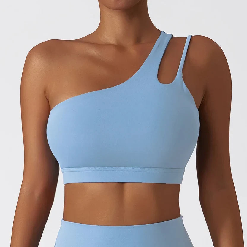 Light blue sports bra worn by a person on a plain background
