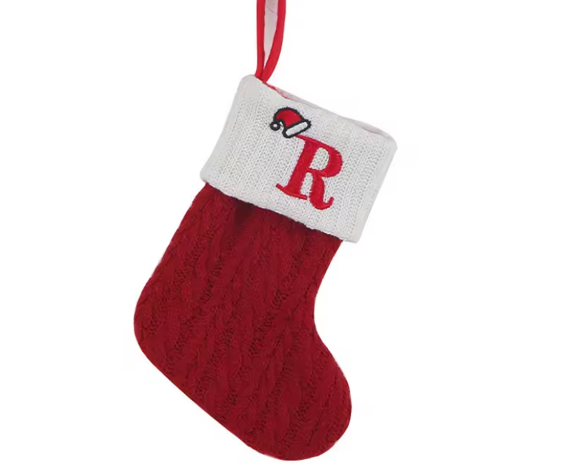 Red Christmas stocking with white cuff featuring a red 'R' on a white background