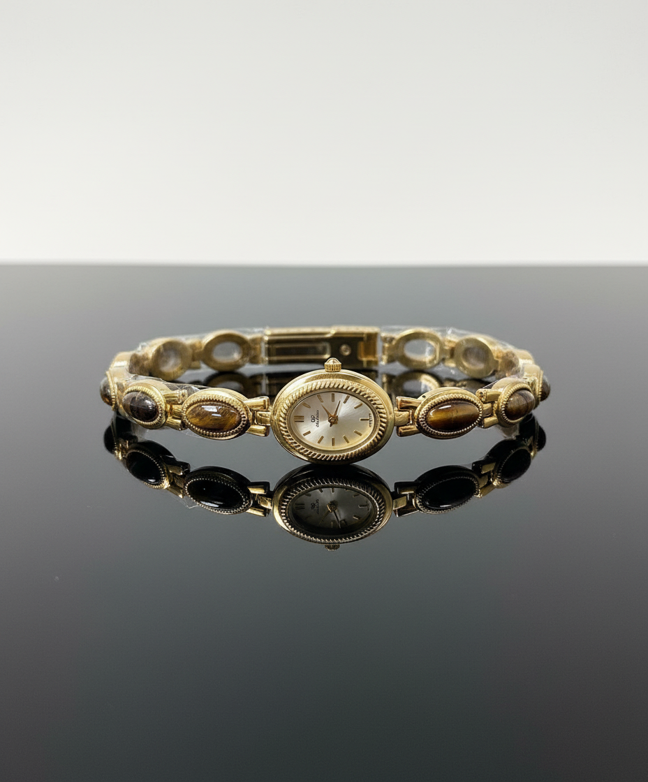 Gold bracelet with a reflective surface