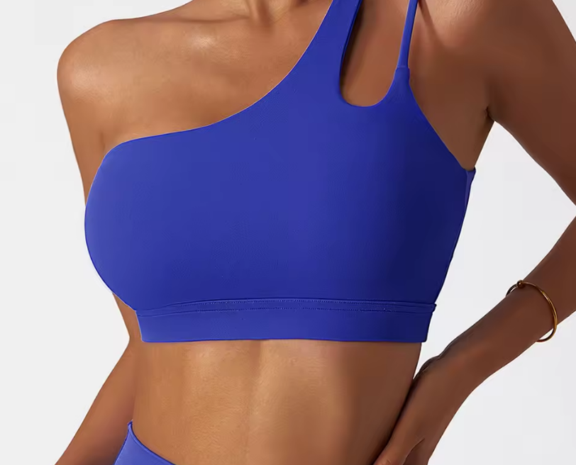 Blue sports bra worn by a person on a white background
